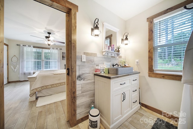 4592 Reid Rd, Edgemoor, SC 29712 - bathroom with plenty of natural light, wood finished floors, vanity, and a ceiling fan