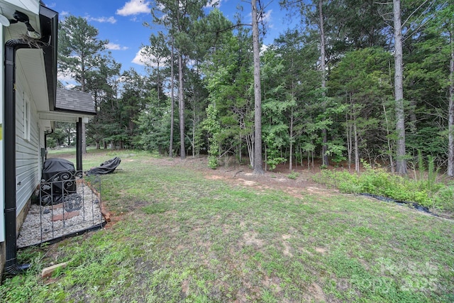 4592 Reid Rd, Edgemoor, SC 29712 - view of green lawn featuring a forest view