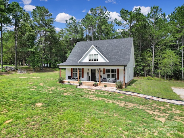 4592 Reid Rd, Edgemoor, SC 29712 - modern farmhouse style home with a porch, a front yard, and roof with shingles