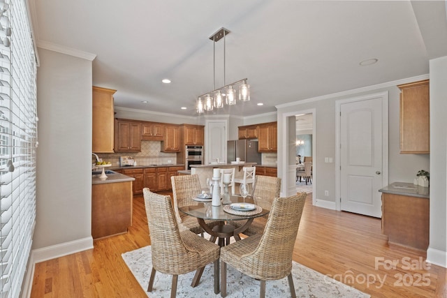 11335 Wescott Hill Dr, Huntersville, NC 28078 - dining area featuring light wood-style floors, recessed lighting, crown molding, and a chandelier