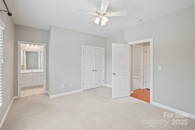 11335 Wescott Hill Dr, Huntersville, NC 28078 - unfurnished bedroom featuring light carpet, a closet, ensuite bath, and a ceiling fan