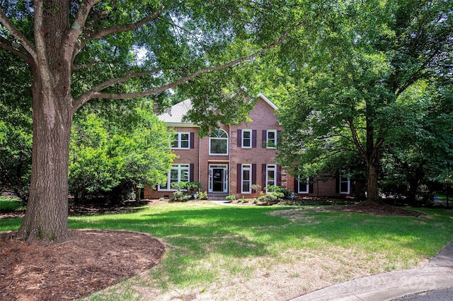 10408 Hadleigh Pl, Charlotte, NC 28210 - colonial house featuring brick siding and a front yard