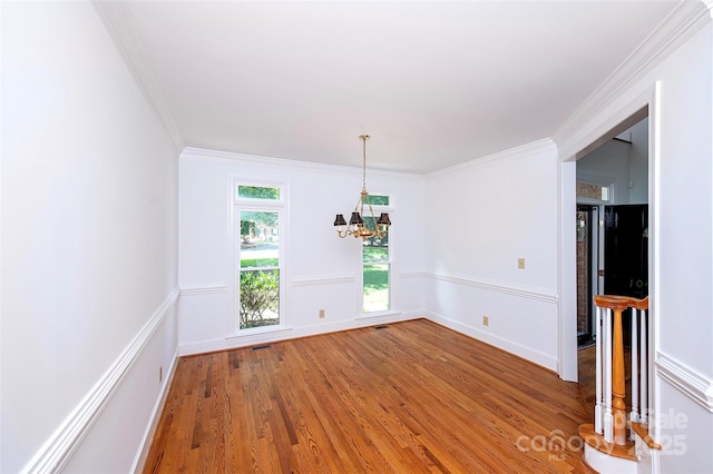 10408 Hadleigh Pl, Charlotte, NC 28210 - unfurnished dining area featuring a chandelier, light wood-style floors, and crown molding