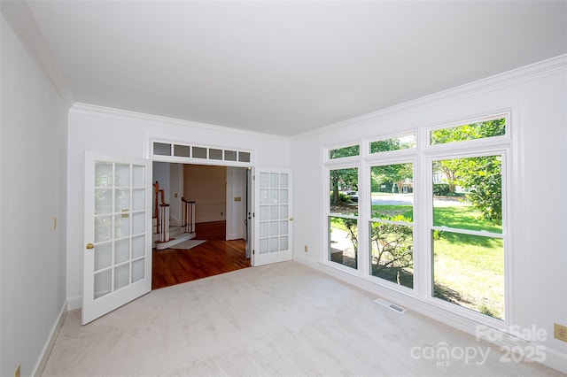 10408 Hadleigh Pl, Charlotte, NC 28210 - spare room featuring french doors, ornamental molding, carpet flooring, and stairway