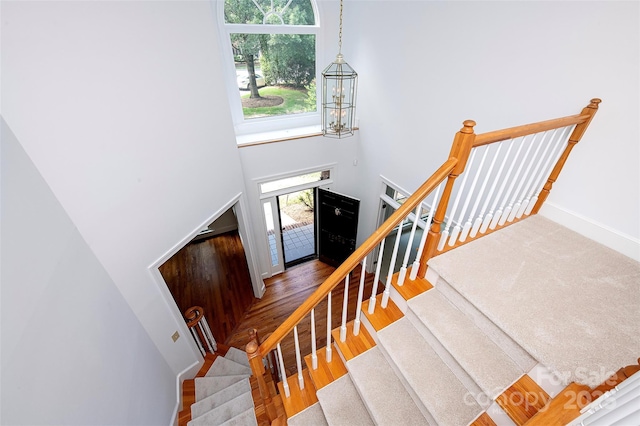10408 Hadleigh Pl, Charlotte, NC 28210 - staircase with a towering ceiling and wood finished floors