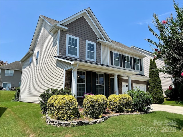 11511 Wilson Mill Ln, Pineville, NC 28134 - craftsman inspired home featuring a front yard, a garage, driveway, and a shingled roof