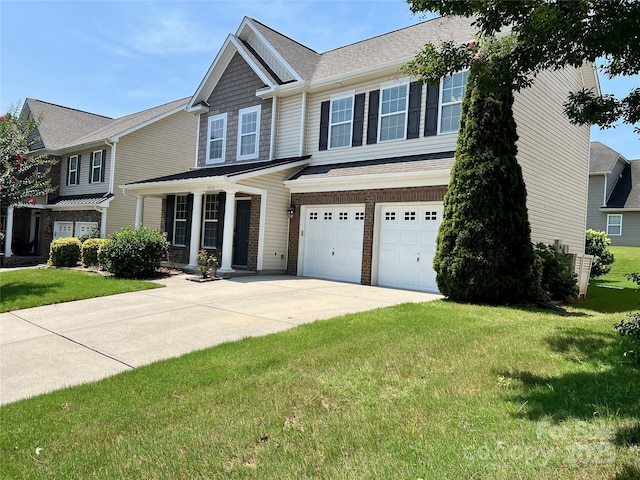 11511 Wilson Mill Ln, Pineville, NC 28134 - view of front facade with concrete driveway, a garage, a front lawn, and a shingled roof