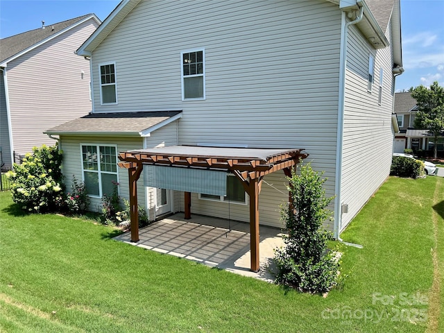 11511 Wilson Mill Ln, Pineville, NC 28134 - rear view of house with a pergola, a patio area, a yard, and roof with shingles