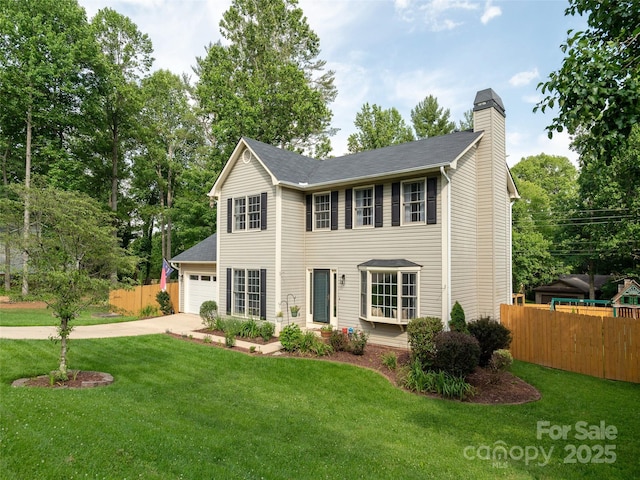 502 Windsor Forest Ct, Fletcher, NC 28732 - view of front facade with concrete driveway, a chimney, and a garage