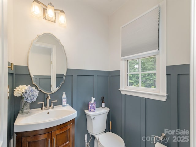 502 Windsor Forest Ct, Fletcher, NC 28732 - half bath with a decorative wall, vanity, and a wainscoted wall