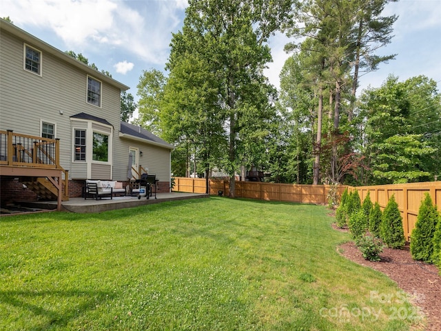 502 Windsor Forest Ct, Fletcher, NC 28732 - fenced backyard featuring a patio, a wooden deck, and an outdoor hangout area