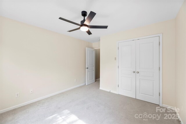 448 River Park Rd, Belmont, NC 28012 - unfurnished bedroom featuring light colored carpet, a closet, and ceiling fan