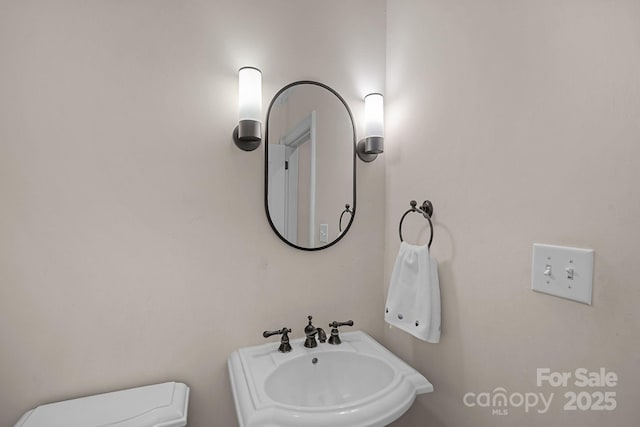 1317 Longleaf Ct, Matthews, NC 28104 - half bath featuring a sink and toilet