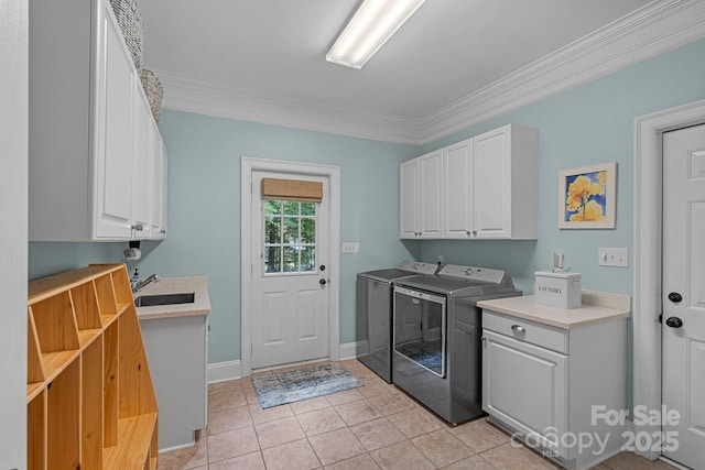 1317 Longleaf Ct, Matthews, NC 28104 - washroom with cabinet space, separate washer and dryer, ornamental molding, and light tile patterned floors