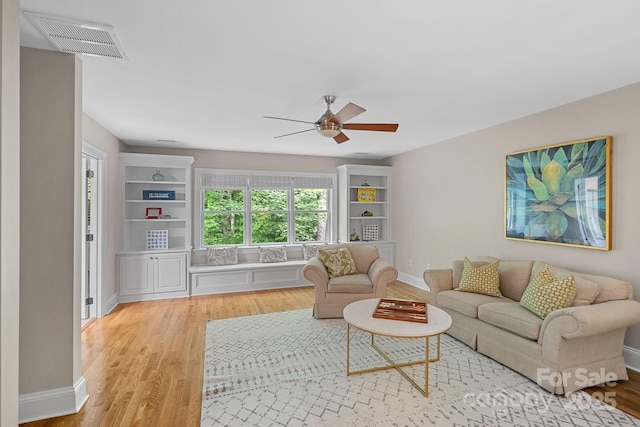 1317 Longleaf Ct, Matthews, NC 28104 - living area featuring a ceiling fan and light wood-style floors