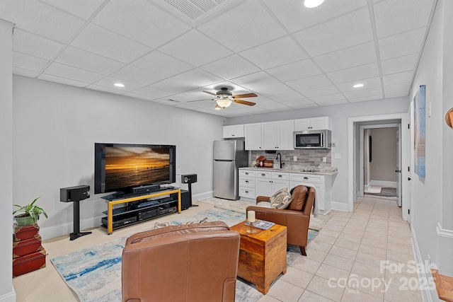 1317 Longleaf Ct, Matthews, NC 28104 - living area featuring ceiling fan, a drop ceiling, recessed lighting, and light tile patterned floors