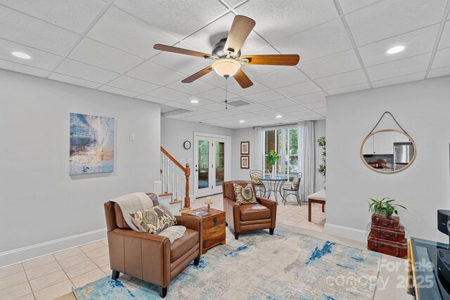 1317 Longleaf Ct, Matthews, NC 28104 - sitting room with ceiling fan, stairs, tile patterned floors, recessed lighting, and a drop ceiling