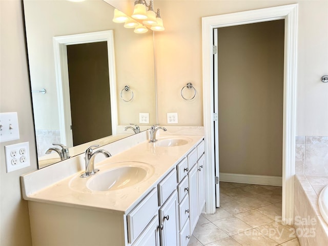 1302 Devonmere Pl, Salisbury, NC 28144 - bathroom with double vanity, a relaxing tiled tub, and tile patterned floors