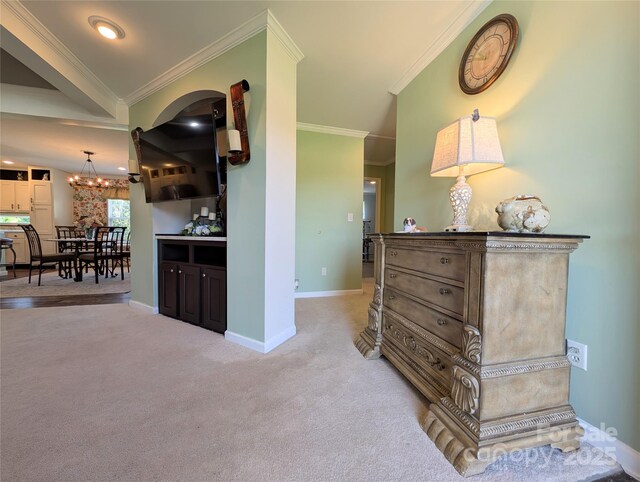 4713 White Store Rd, Wingate, NC 28174 - hallway featuring ornamental molding, light colored carpet, and a chandelier