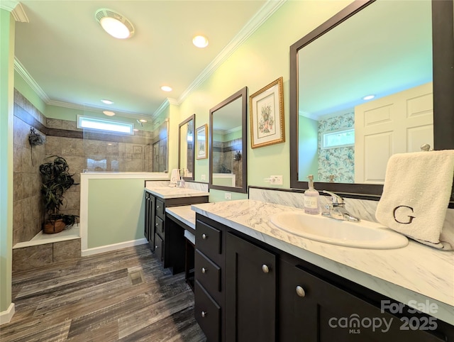 4713 White Store Rd, Wingate, NC 28174 - bathroom featuring a walk in shower, two vanities, crown molding, wood finished floors, and recessed lighting