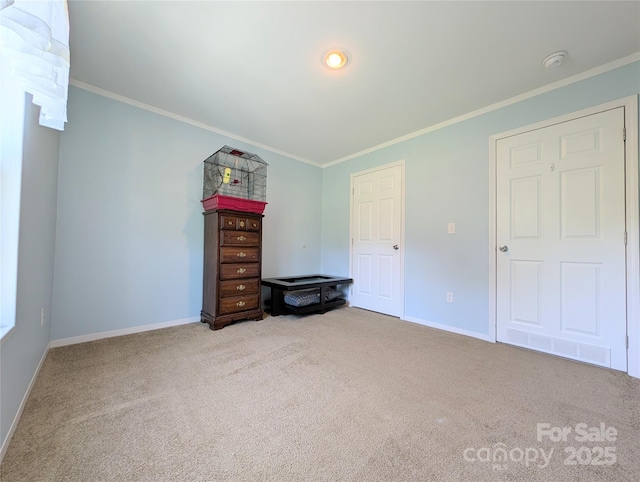 4713 White Store Rd, Wingate, NC 28174 - unfurnished bedroom featuring carpet flooring and crown molding