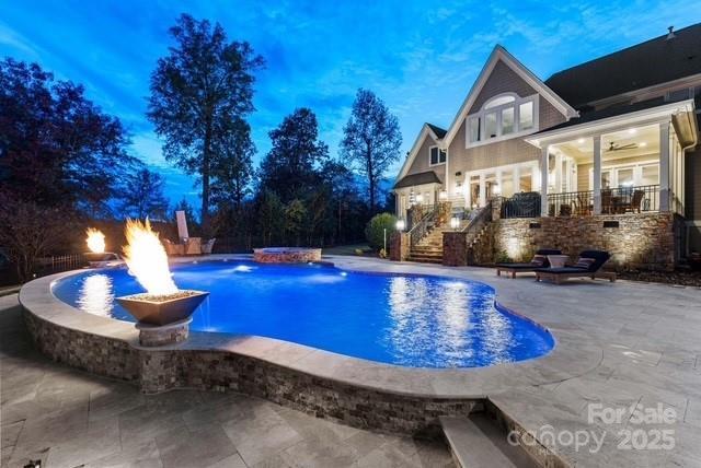 6216 N Rd, York, SC 29745 - swimming pool with stairway, a patio area, and a hot tub