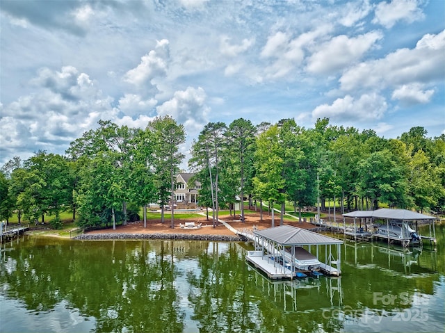 6216 N Rd, York, SC 29745 - dock area with boat lift, a water view, and view of scattered trees