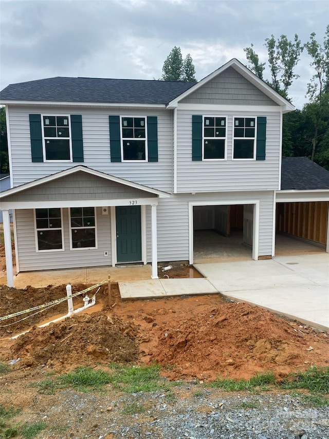 323 Conner St, Lancaster, SC 29720 - view of front of home featuring driveway, a carport, and an attached garage