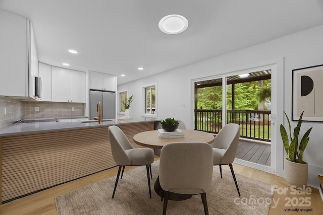 6501 Piney Path Rd, Charlotte, NC 28212 - dining room with light wood finished floors and recessed lighting