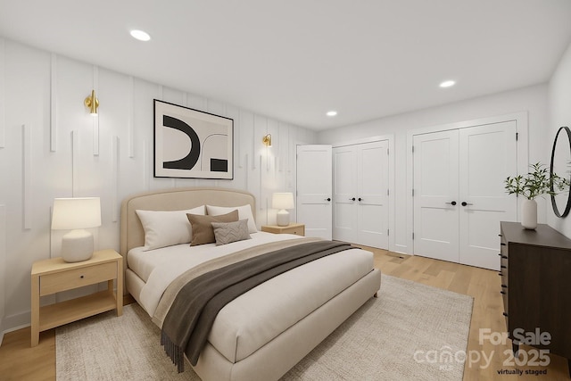 6501 Piney Path Rd, Charlotte, NC 28212 - bedroom featuring two closets, light wood-style flooring, and recessed lighting