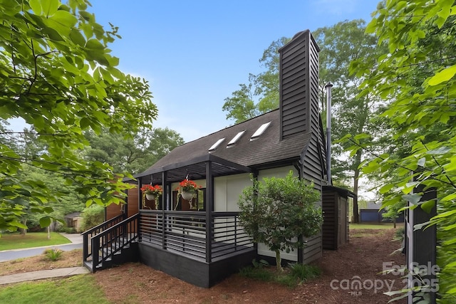 6501 Piney Path Rd, Charlotte, NC 28212 - view of front of home with a shingled roof and a chimney