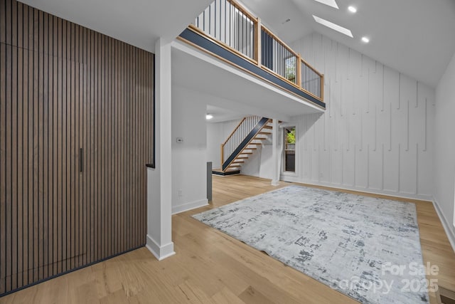6501 Piney Path Rd, Charlotte, NC 28212 - entryway with a skylight, stairs, wood finished floors, and high vaulted ceiling