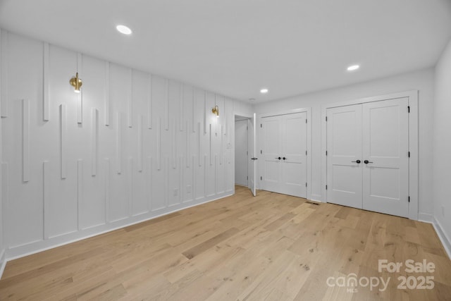 6501 Piney Path Rd, Charlotte, NC 28212 - unfurnished bedroom with wood finished floors, two closets, and recessed lighting