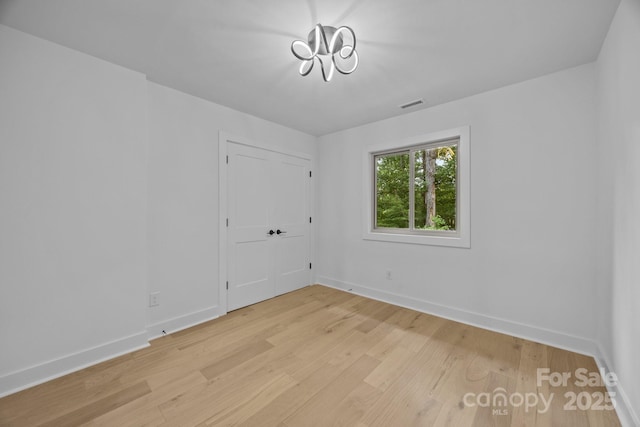 6501 Piney Path Rd, Charlotte, NC 28212 - empty room featuring light wood-style flooring and baseboards