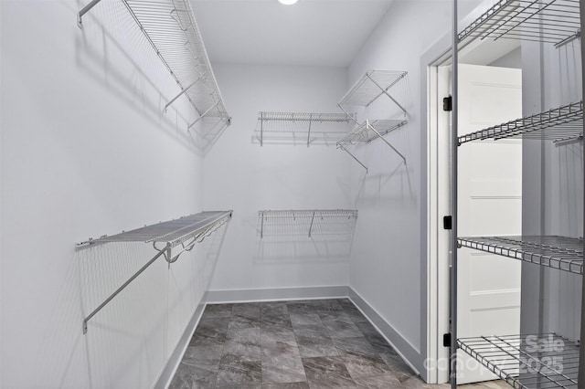 1019 Null Rd, Lincolnton, NC 28092 - walk in closet featuring stone finish flooring