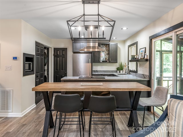 107 N Garden Ct, Fletcher, NC 28732 - dining room with stacked washer / dryer, wood finished floors, and recessed lighting