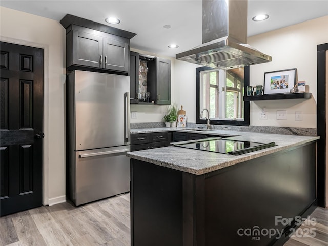 107 N Garden Ct, Fletcher, NC 28732 - kitchen with freestanding refrigerator, island exhaust hood, a peninsula, open shelves, and cooktop