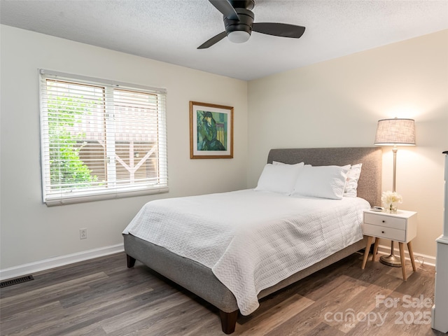 107 N Garden Ct, Fletcher, NC 28732 - bedroom featuring wood finished floors, a ceiling fan, and a textured ceiling