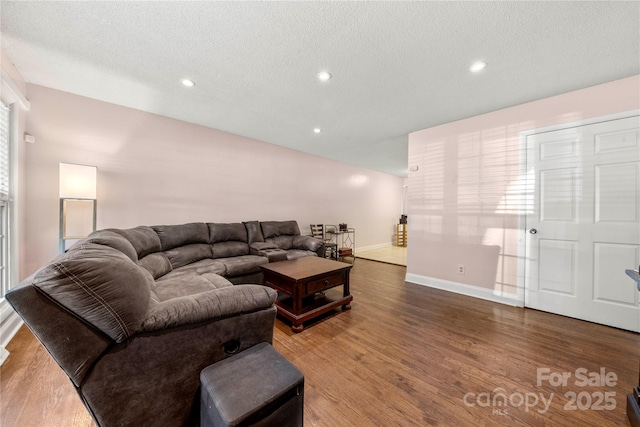3130 Erskine Dr, Charlotte, NC 28205 - living area with wood finished floors, a textured ceiling, and recessed lighting