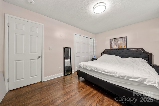 3130 Erskine Dr, Charlotte, NC 28205 - bedroom featuring wood finished floors, a textured ceiling, and a closet