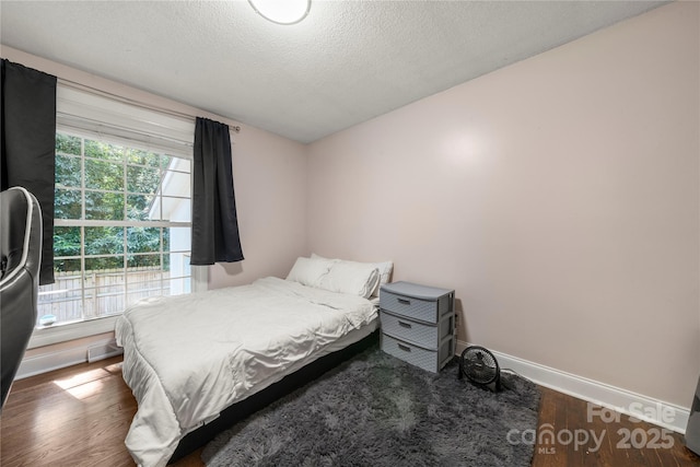 3130 Erskine Dr, Charlotte, NC 28205 - bedroom featuring wood finished floors and a textured ceiling