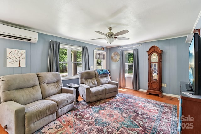 19 Lockman Rd, Maggie Valley, NC 28751 - living room with a wall mounted AC, wood finished floors, and ceiling fan