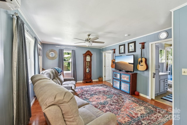 19 Lockman Rd, Maggie Valley, NC 28751 - living area with ornamental molding, a ceiling fan, a wall unit AC, and wood finished floors