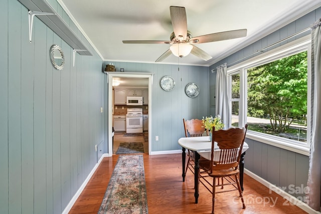 19 Lockman Rd, Maggie Valley, NC 28751 - dining room featuring ornamental molding, wood finished floors, a ceiling fan, and wood walls