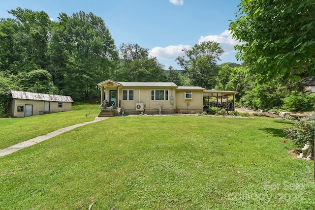 19 Lockman Rd, Maggie Valley, NC 28751 - view of front facade with a front yard and an outdoor structure