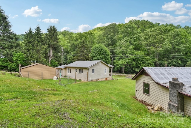 19 Lockman Rd, Maggie Valley, NC 28751 - view of grassy yard with a wooded view