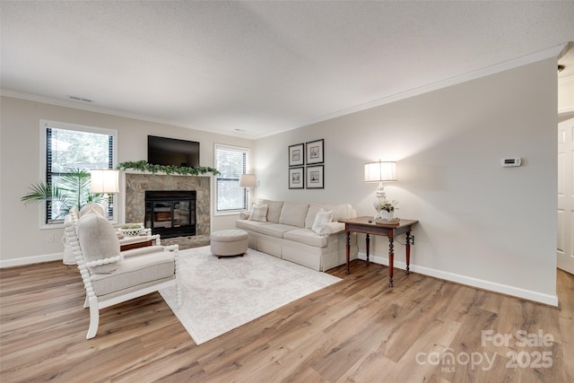 353 Tall Oaks Trl, Fort Mill, SC 29715 - living room with light wood-type flooring, plenty of natural light, crown molding, and a fireplace