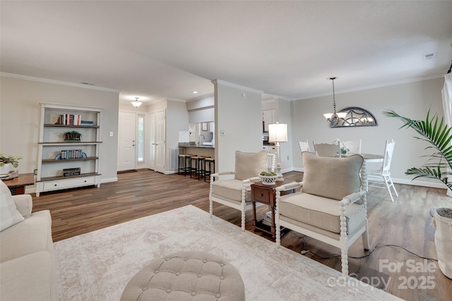 353 Tall Oaks Trl, Fort Mill, SC 29715 - living room with wood finished floors, ornamental molding, a chandelier, and recessed lighting