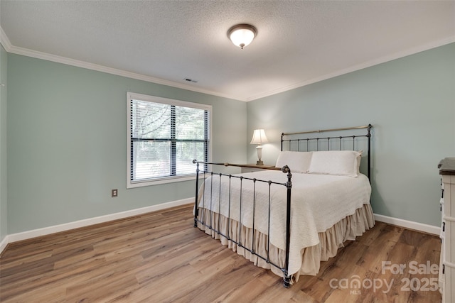353 Tall Oaks Trl, Fort Mill, SC 29715 - bedroom with wood finished floors, ornamental molding, and a textured ceiling