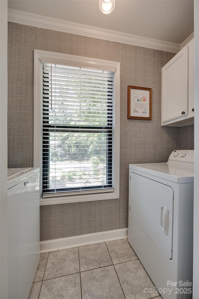 353 Tall Oaks Trl, Fort Mill, SC 29715 - washroom with washer / dryer, ornamental molding, cabinet space, a textured ceiling, and light tile patterned flooring